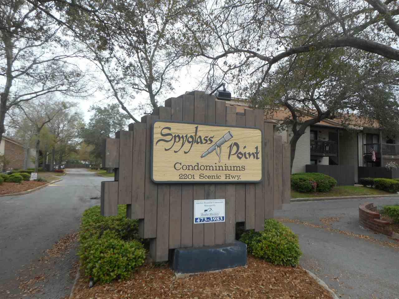 2201 Scenic Highway, Unit D6 Pensacola, FL 32503 - Photo 1 of 11 a sign on the side of a building