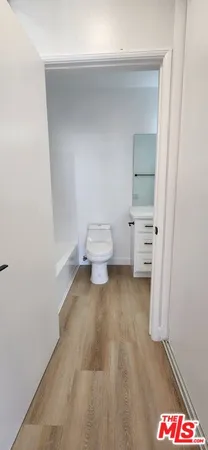 a bathroom with a bathtub and a toilet
