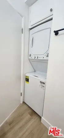 a spacious bathroom with double vanity and a mirror