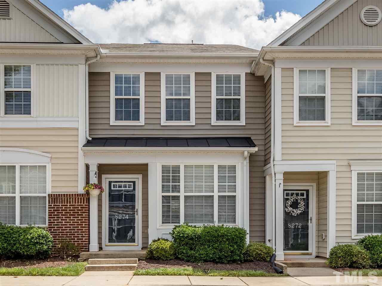 8274 City Loft Court Raleigh, NC 27613 - Photo 1 of 20 a front view of a brick house many windows