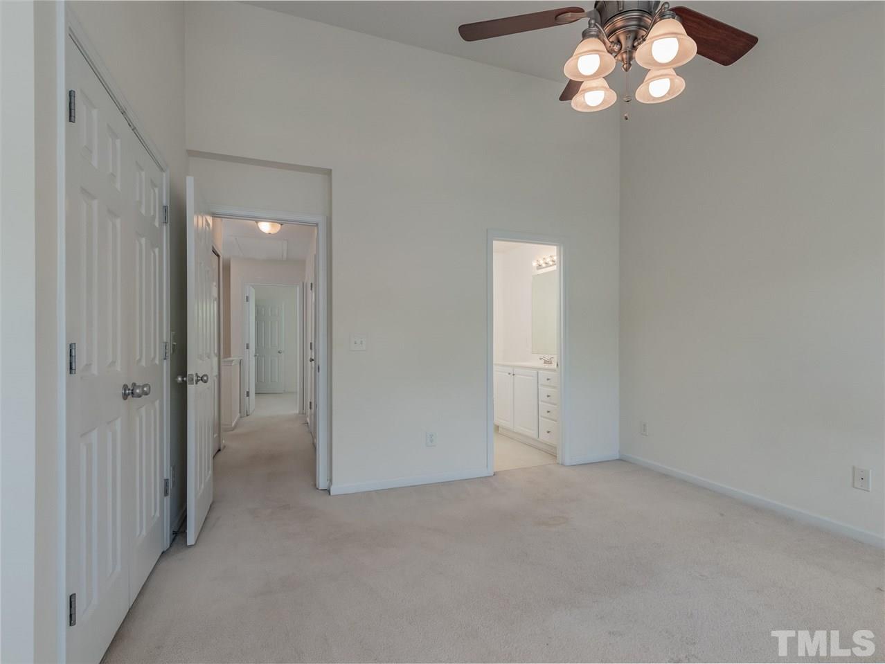 8274 City Loft Court Raleigh, NC 27613 - Photo 12 of 20 a view of an empty room with a chandelier fan