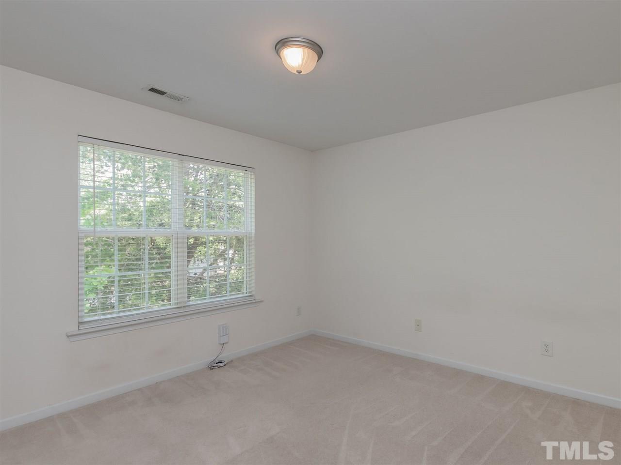 8274 City Loft Court Raleigh, NC 27613 - Photo 14 of 20 an empty room with a window