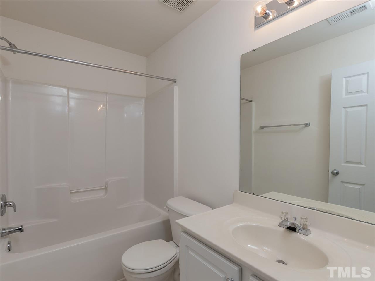 8274 City Loft Court Raleigh, NC 27613 - Photo 15 of 20 a bathroom with a sink toilet and shower