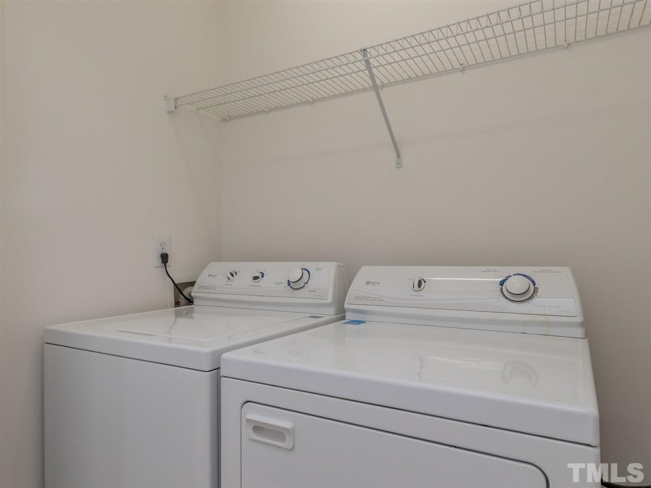 8274 City Loft Court Raleigh, NC 27613 - Photo 16 of 20 a utility room with dryer and washer