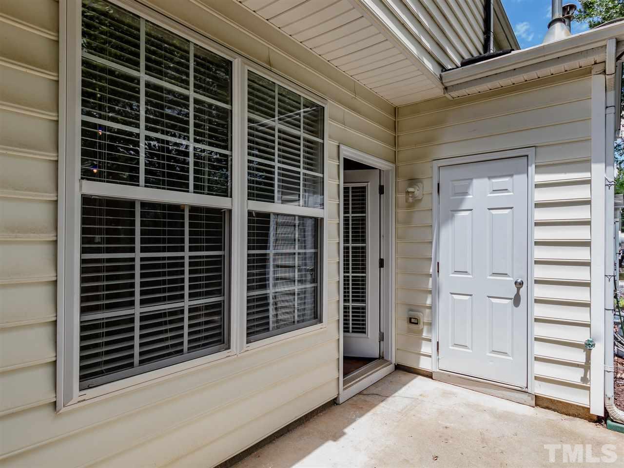 8274 City Loft Court Raleigh, NC 27613 - Photo 18 of 20 a view of wooden door