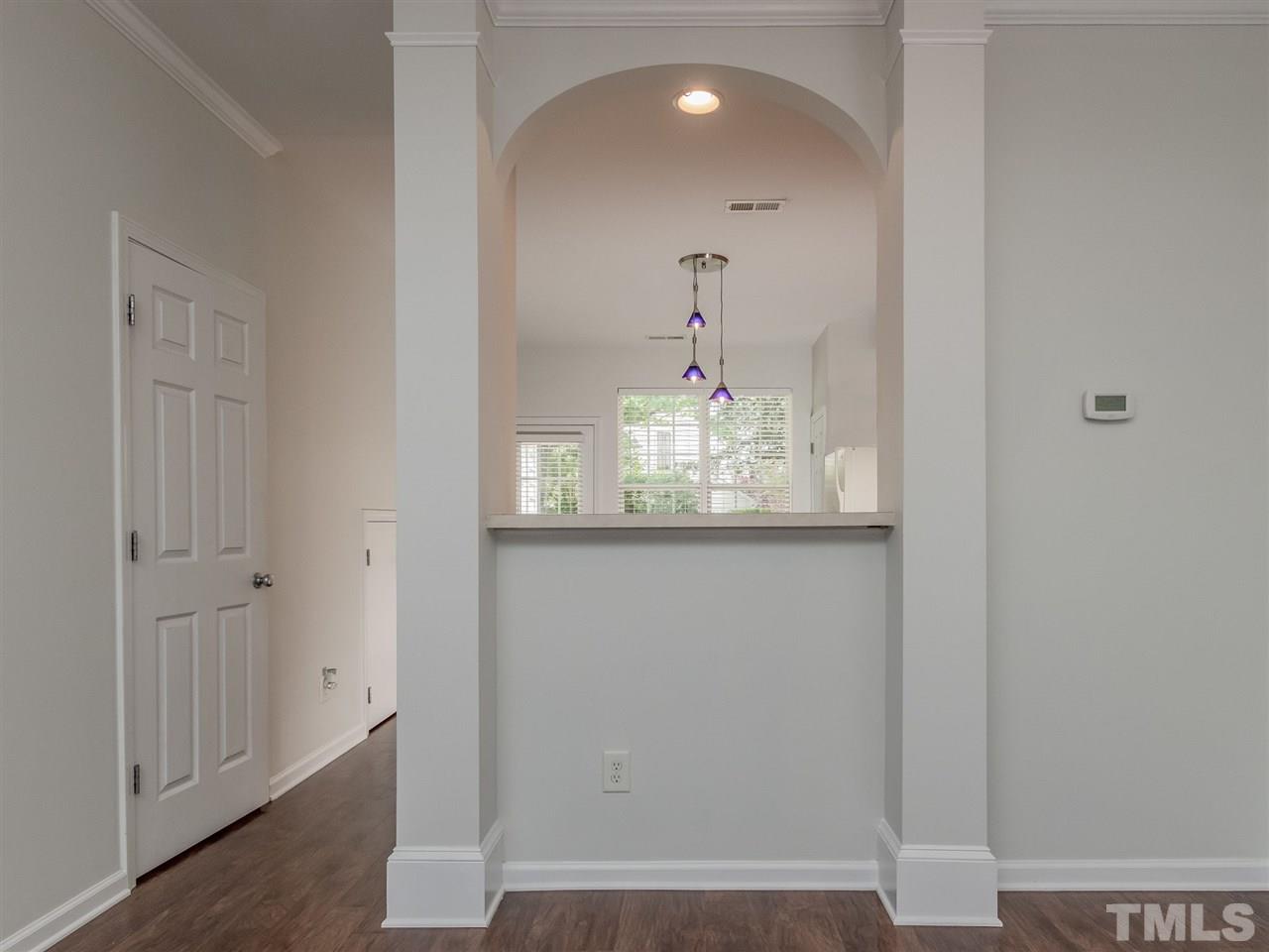 8274 City Loft Court Raleigh, NC 27613 - Photo 6 of 20 a view of a hallway with wooden floor