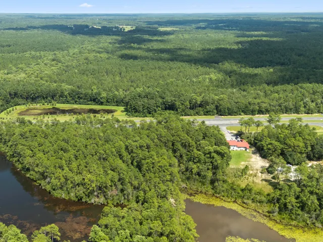 a view of a field with an ocean view