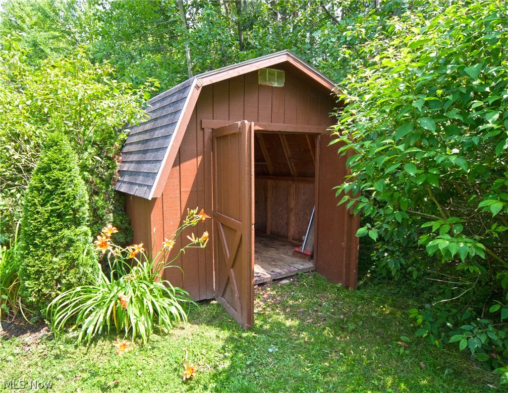 9164 Mayfield Road Chesterland, OH 44026 - Photo 32 of 35 Convenient storage shed in the back yard. Beautiful day lilies.