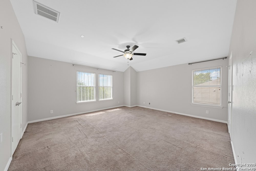 8411 Copperbluff Converse, TX 78109 - Photo 18 of 31 a view of an empty room with a window