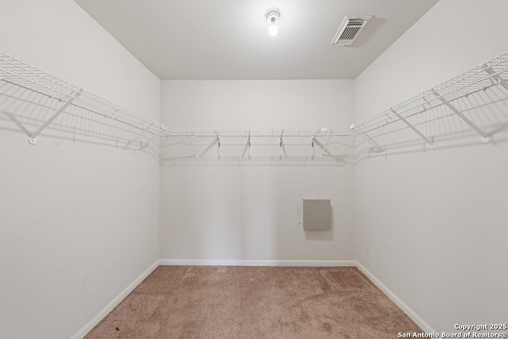 8411 Copperbluff Converse, TX 78109 - Photo 20 of 31 a view of a room with racks on the wall