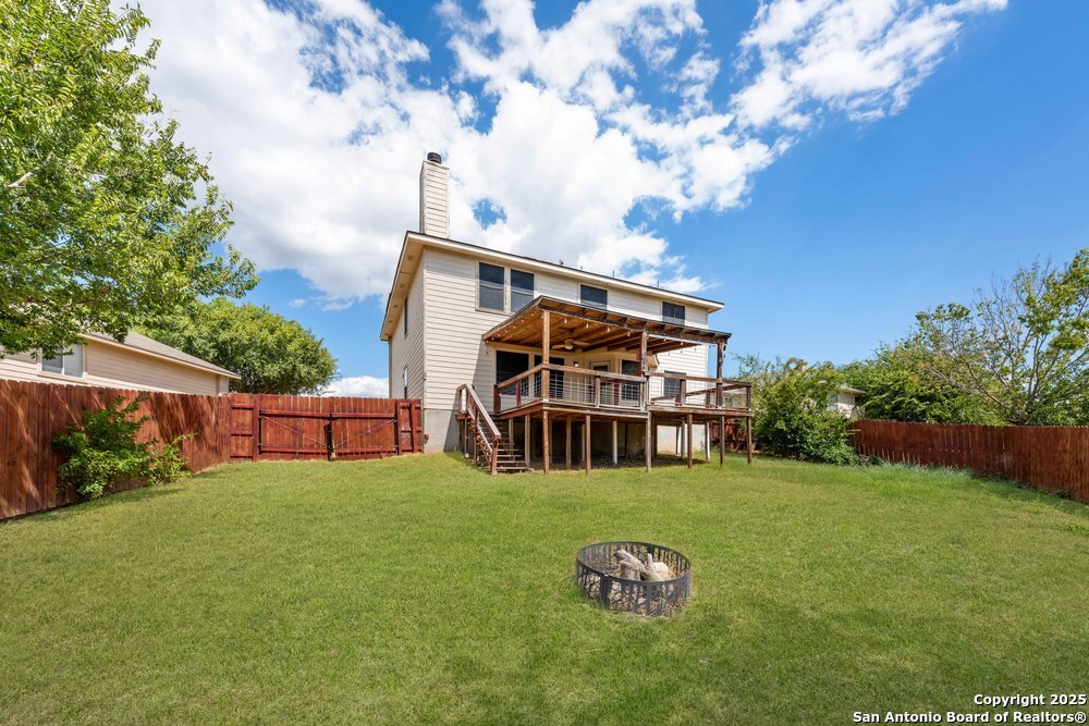 8411 Copperbluff Converse, TX 78109 - Photo 30 of 31 a view of a house with backyard and garden
