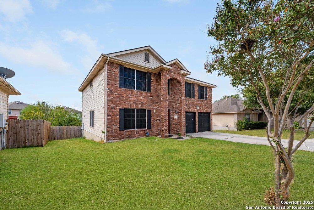 8411 Copperbluff Converse, TX 78109 - Photo 3 of 31 a front view of house with yard and green space
