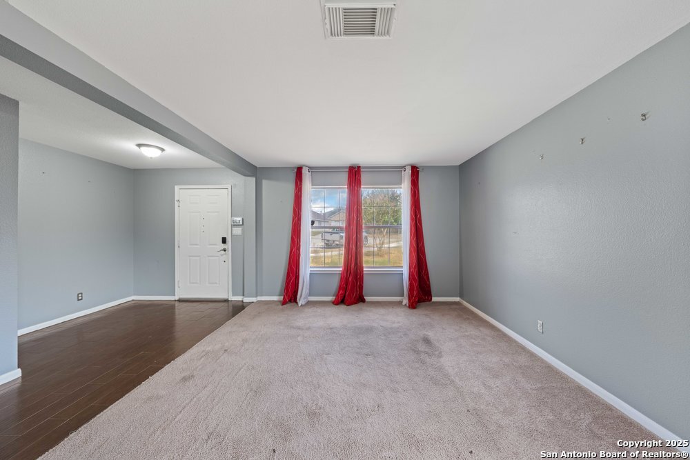 8411 Copperbluff Converse, TX 78109 - Photo 5 of 31 wooden floor and windows in a room