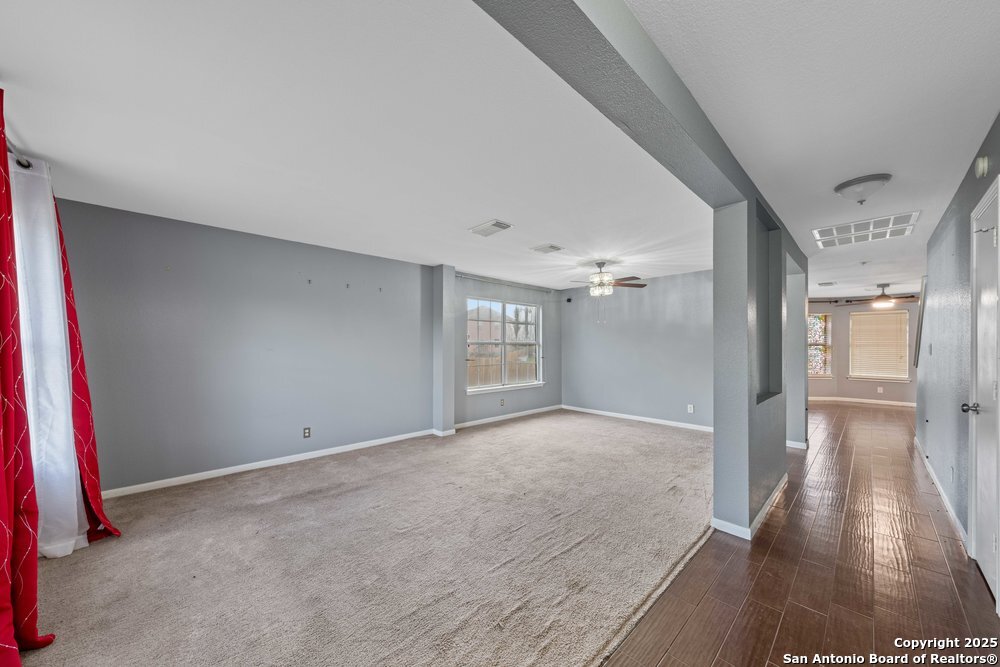 8411 Copperbluff Converse, TX 78109 - Photo 6 of 31 a view of livingroom with hardwood floor and a ceiling fan