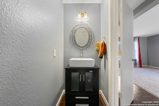 a bathroom with a sink and a mirror