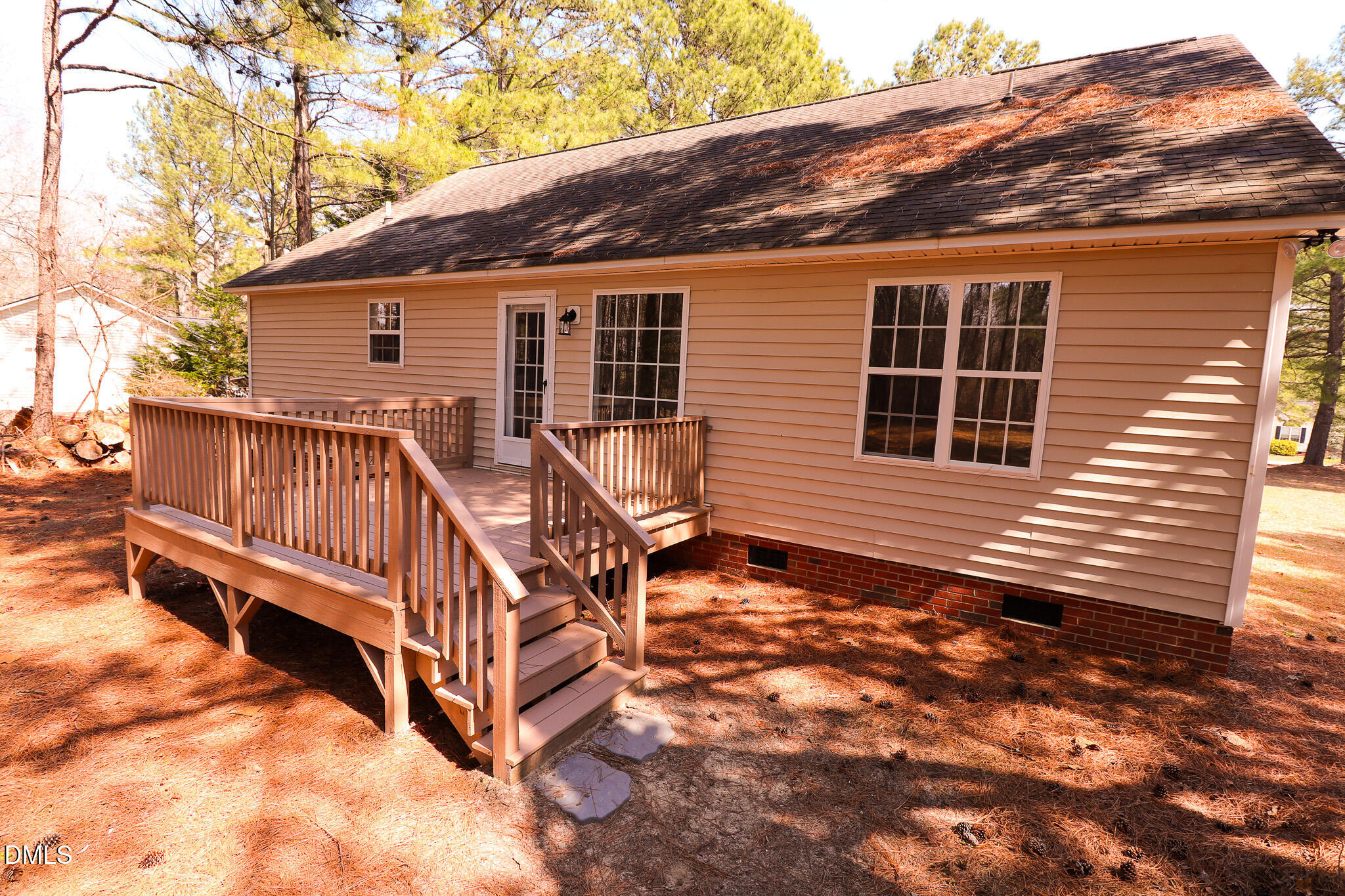55 Edward Court Willow Spring, NC 27592 - Photo 13 of 25 a view of house with wooden deck and a backyard
