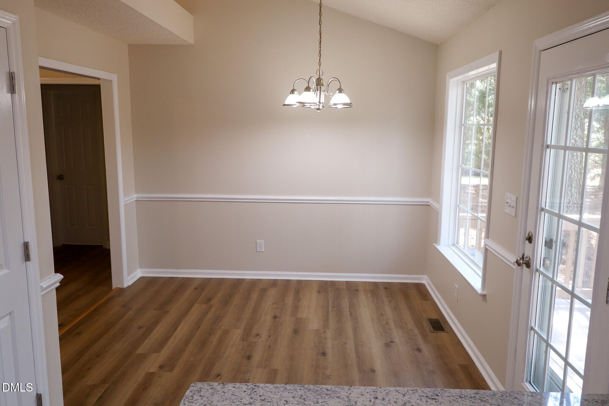 55 Edward Court Willow Spring, NC 27592 - Photo 17 of 25 wooden floor in an empty room with a window