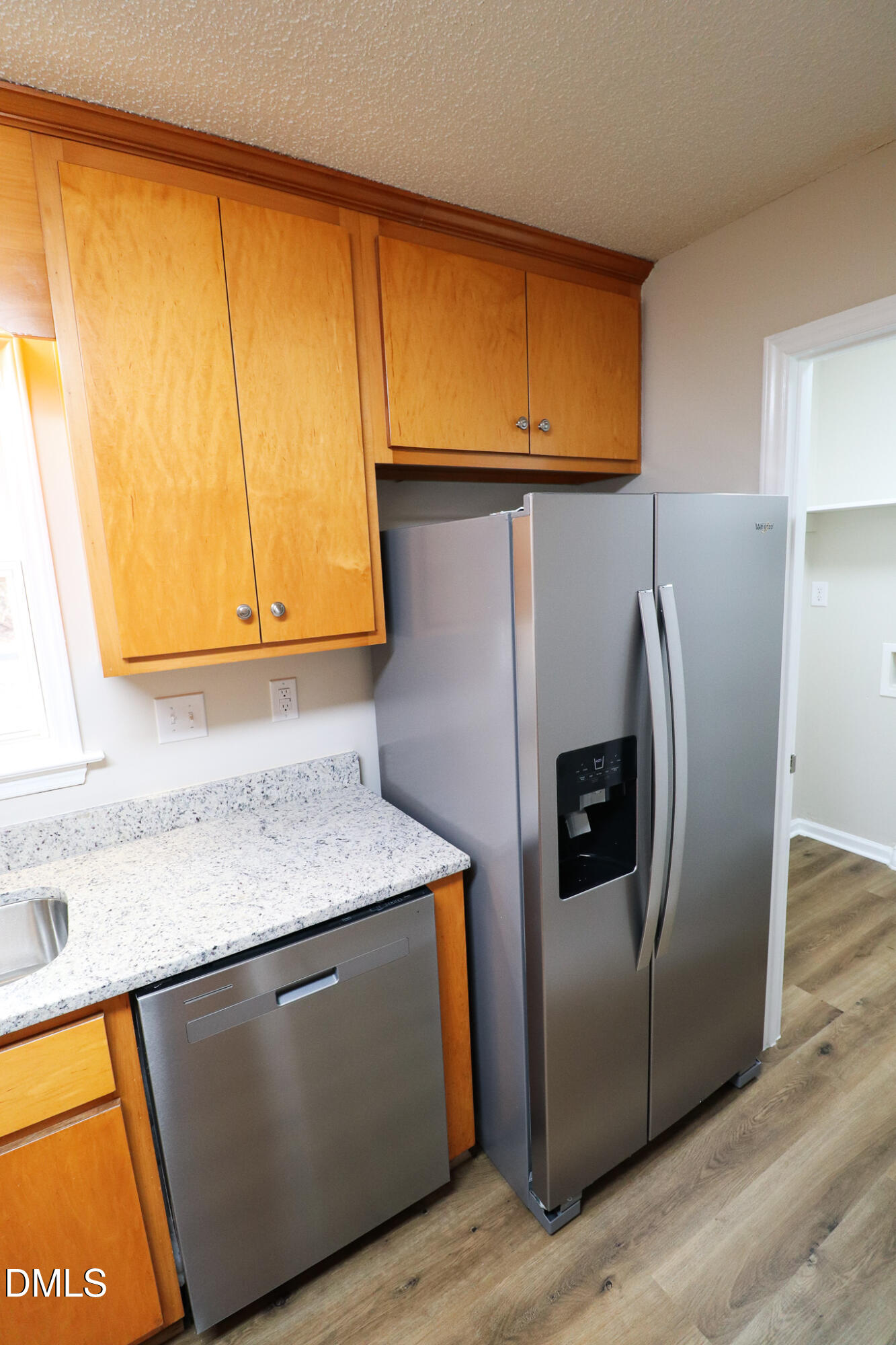55 Edward Court Willow Spring, NC 27592 - Photo 21 of 25 a kitchen with stainless steel appliances granite countertop a sink and a refrigerator
