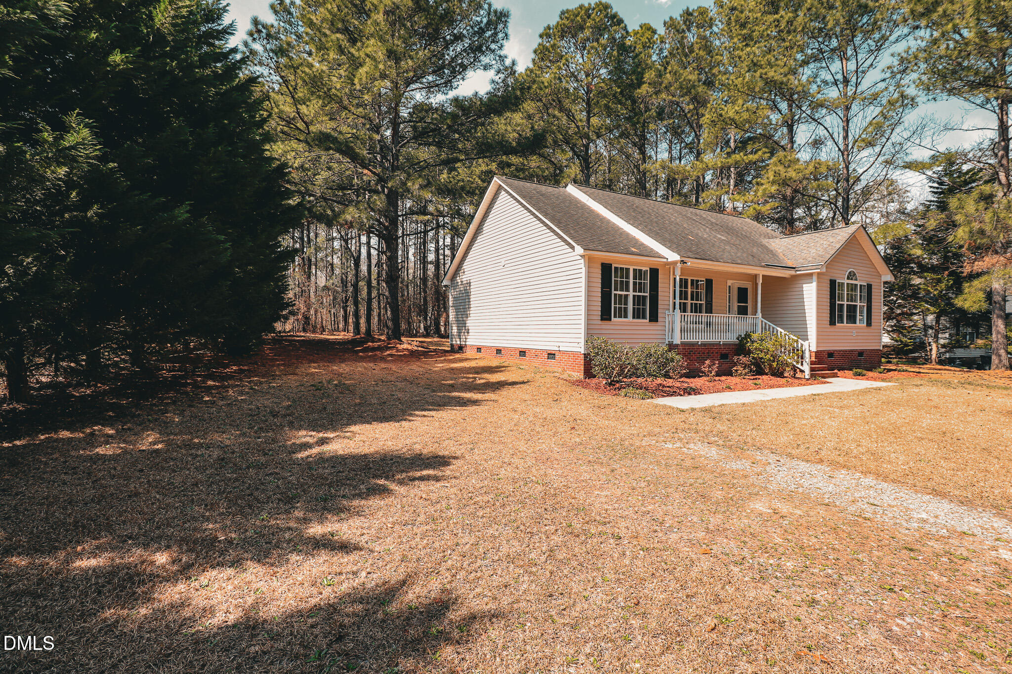 55 Edward Court Willow Spring, NC 27592 - Photo 7 of 25 a view of a yard in front of a house with large trees