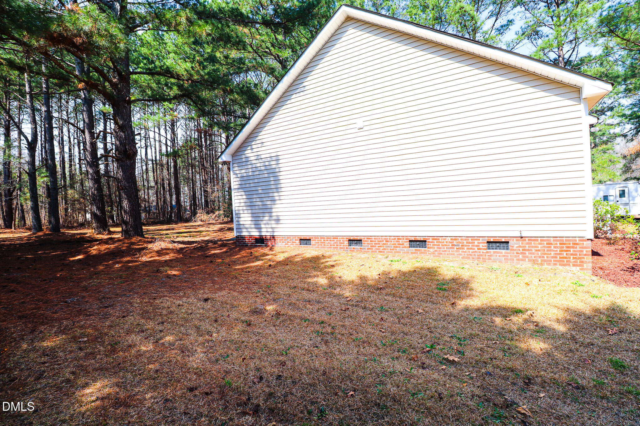 55 Edward Court Willow Spring, NC 27592 - Photo 9 of 25 a view of a backyard with large trees