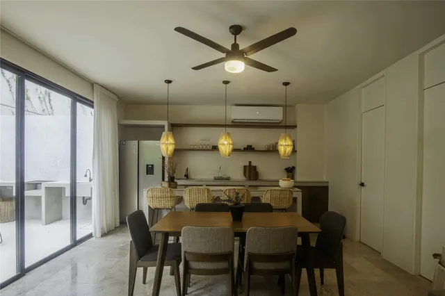 a dining room with furniture and window
