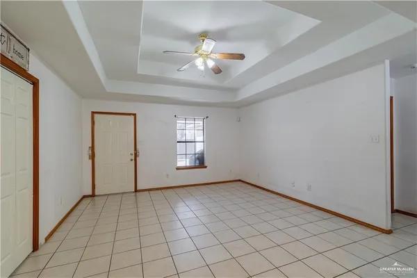 a view of an empty room with a window