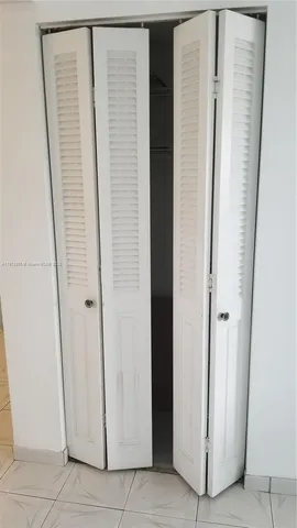 a bathroom with a shower and a door