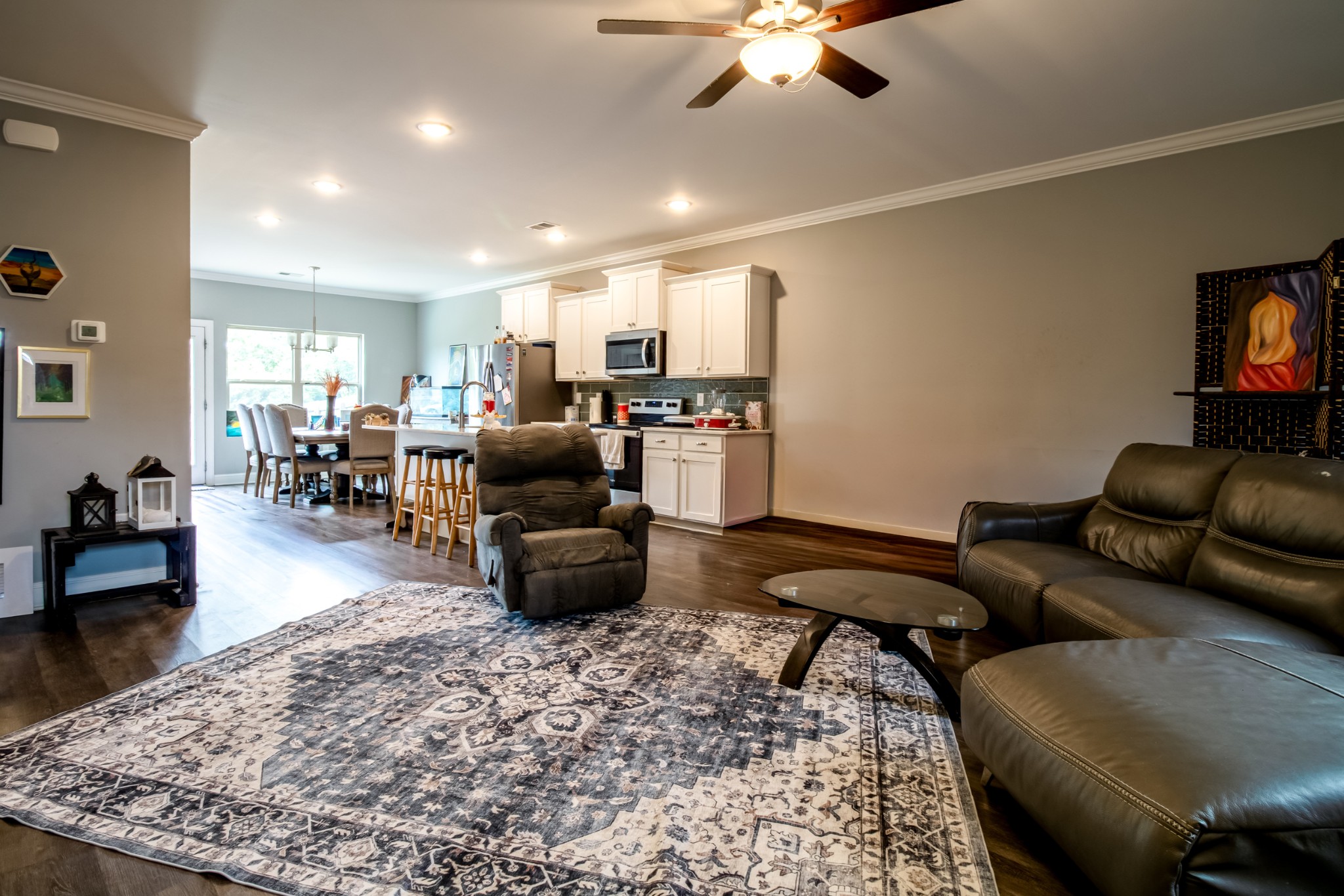 628 Bella Court Lebanon, TN 37087 - Photo 11 of 56 a living room with furniture and a dining area with kitchen view