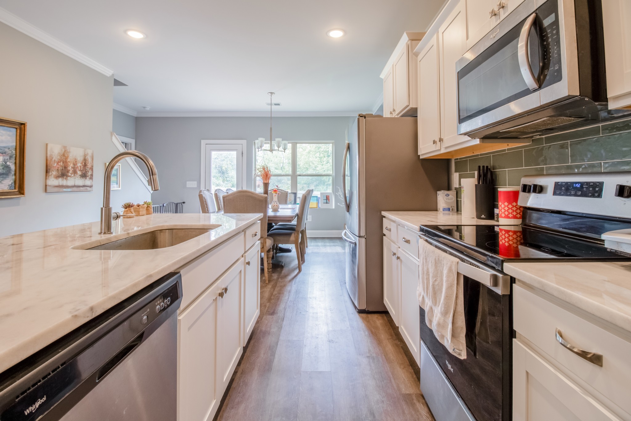 628 Bella Court Lebanon, TN 37087 - Photo 16 of 56 a kitchen with stainless steel appliances a sink stove and cabinets
