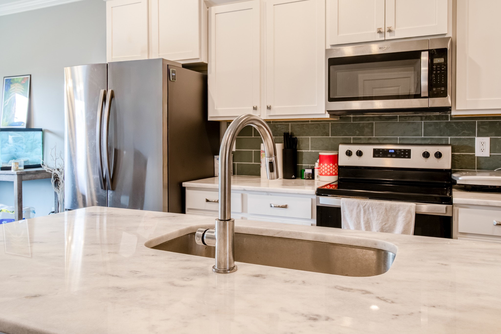 628 Bella Court Lebanon, TN 37087 - Photo 17 of 56 a kitchen with stainless steel appliances granite countertop a stove a refrigerator and a microwave