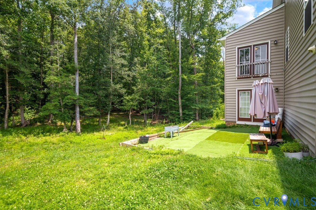 9013 Bailey Hill Road Midlothian, VA 23112 - Photo 56 of 56 Expansive backyard featuring a lush natural tree l