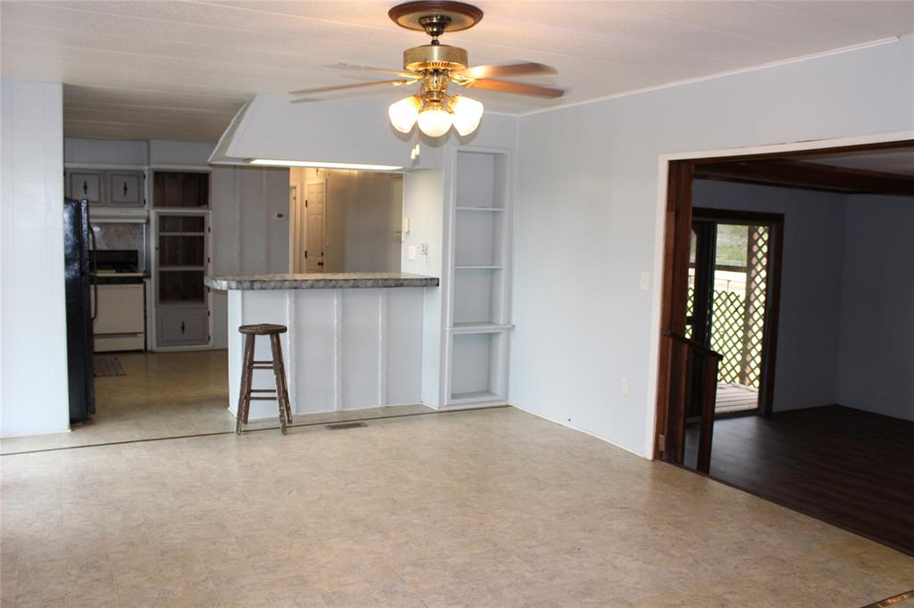 3800 Dorcheat Road Minden, LA 71055 - Photo 24 of 40 a view of an empty room with a window and a kitchen