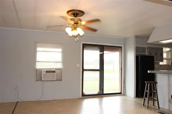 a view of a chandelier fan in the hallway