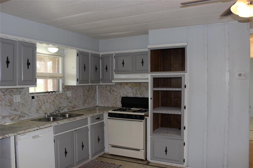 3800 Dorcheat Road Minden, LA 71055 - Photo 29 of 40 a kitchen with a sink and a stove top oven