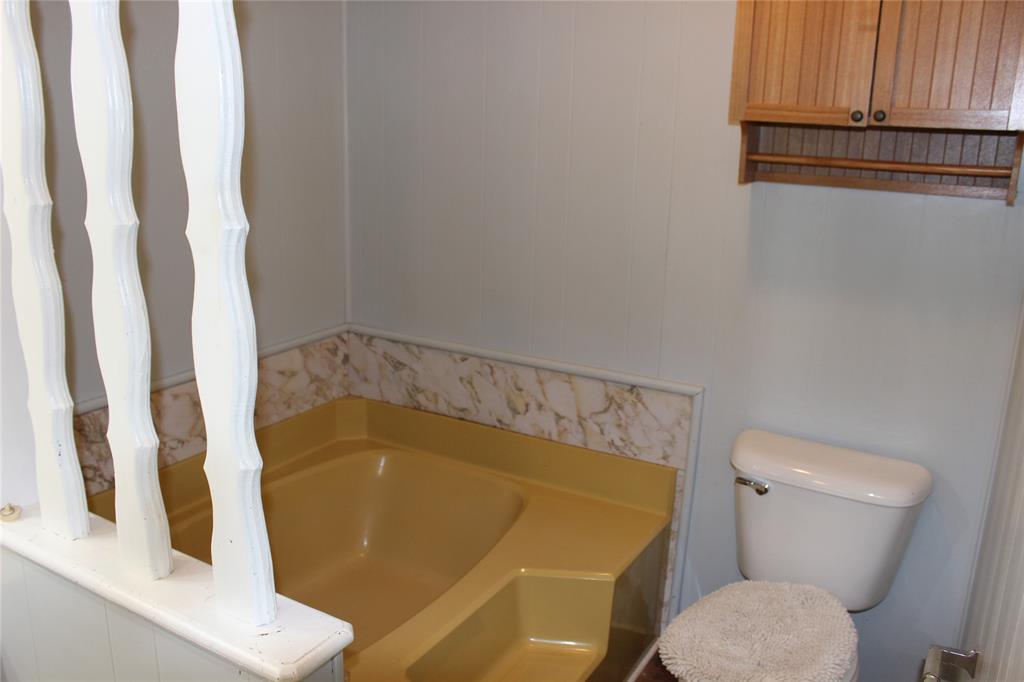 3800 Dorcheat Road Minden, LA 71055 - Photo 36 of 40 a bathroom with a sink and a toilet