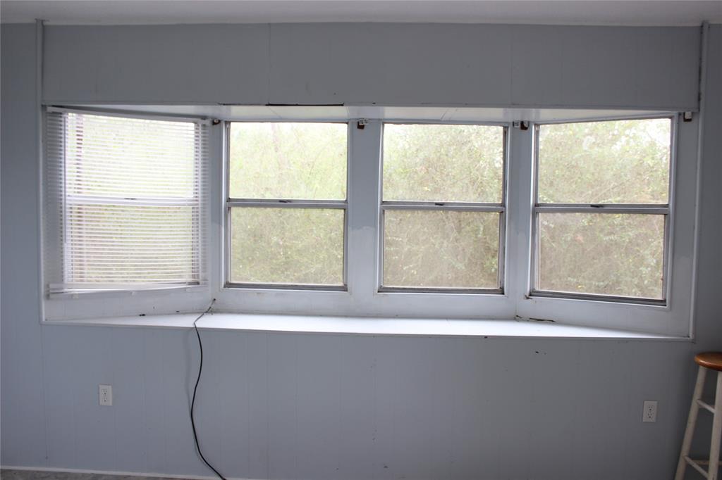 3800 Dorcheat Road Minden, LA 71055 - Photo 37 of 40 a view of a bath tub sitting in a bathroom next to a window