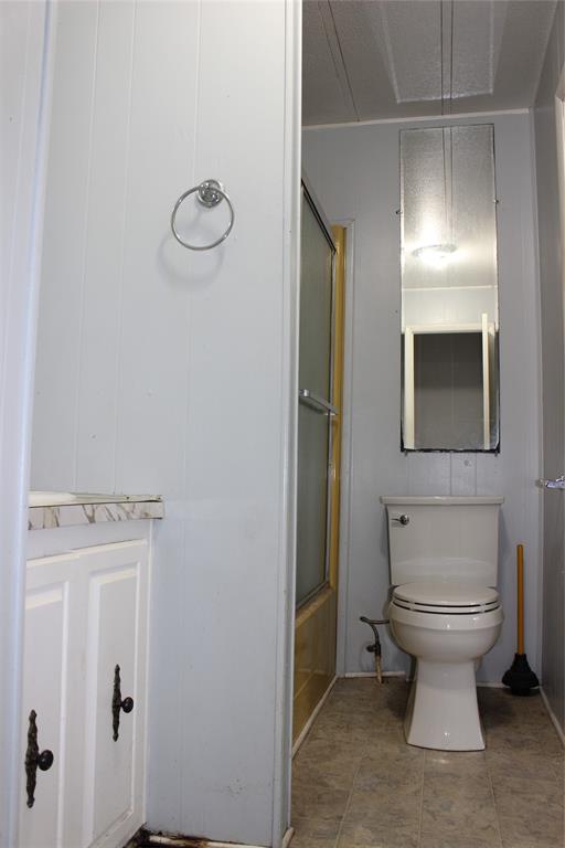 3800 Dorcheat Road Minden, LA 71055 - Photo 39 of 40 a bathroom with a toilet sink and mirror