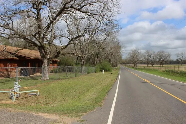 a view of a swimming pool with a yard
