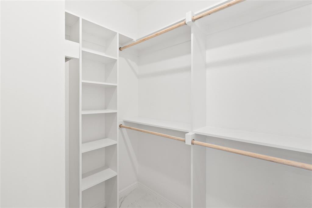 5014 Mission Avenue, Unit A Dallas, TX 75206 - Photo 13 of 26 a view of walk in closet with empty racks