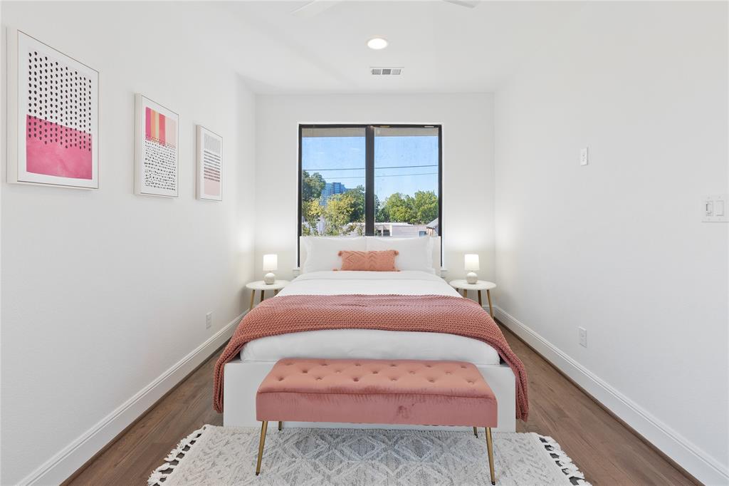 5014 Mission Avenue, Unit A Dallas, TX 75206 - Photo 15 of 26 a bed room with a bed and a large window