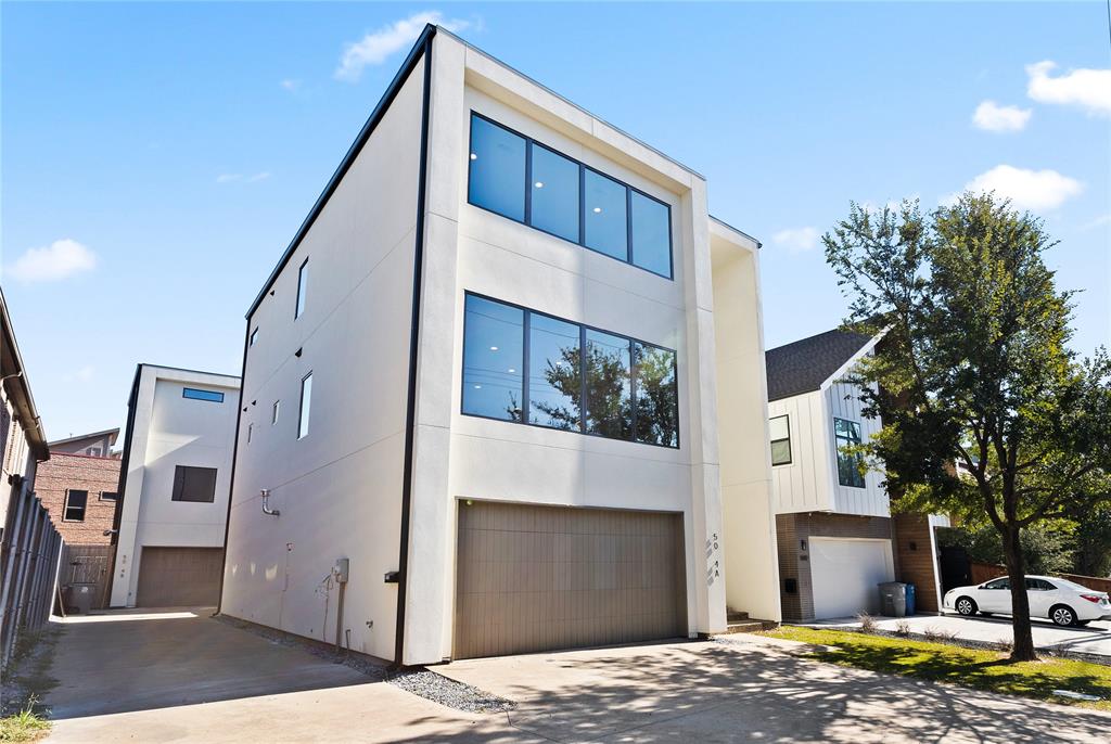 5014 Mission Avenue, Unit A Dallas, TX 75206 - Photo 3 of 26 a front view of a house with a garage