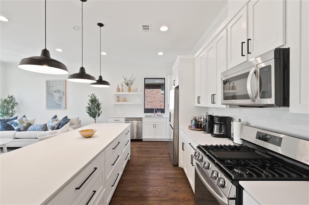 5014 Mission Avenue, Unit A Dallas, TX 75206 - Photo 5 of 26 a kitchen with a stove a sink and a refrigerator