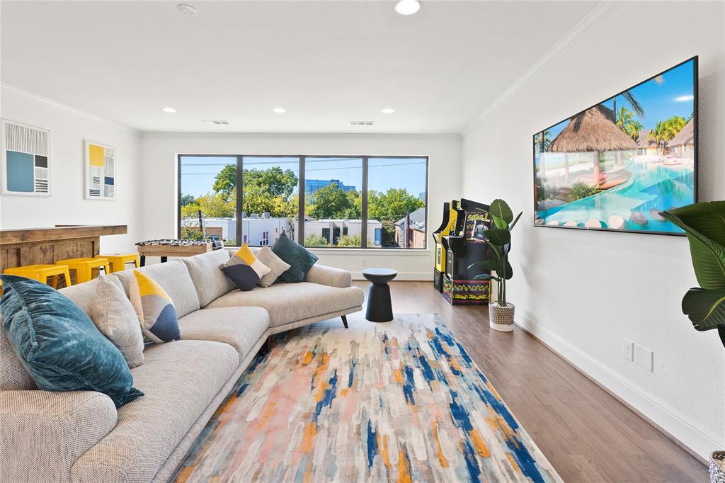5014 Mission Avenue, Unit A Dallas, TX 75206 - Photo 8 of 26 a living room with furniture and a large window