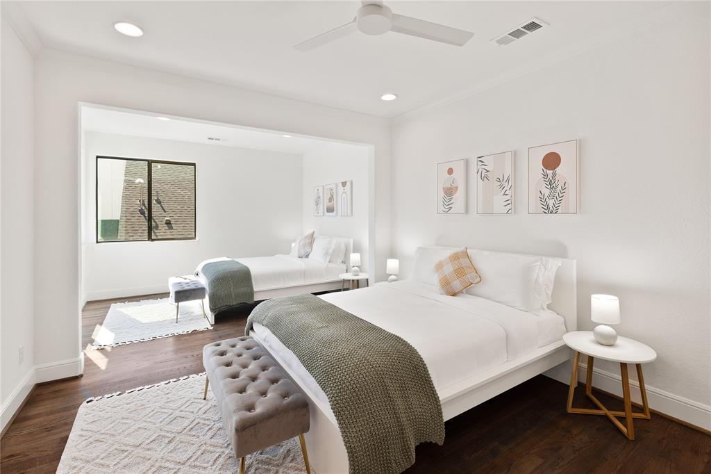 5014 Mission Avenue, Unit A Dallas, TX 75206 - Photo 10 of 26 a bedroom with a bed and wooden floor