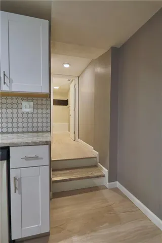 a bathroom with a toilet a sink and bathtub