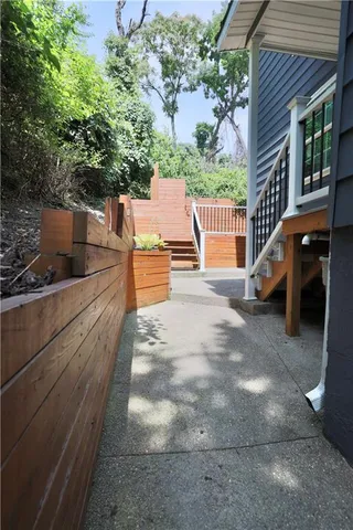 a view of entryway with wooden floor and fence