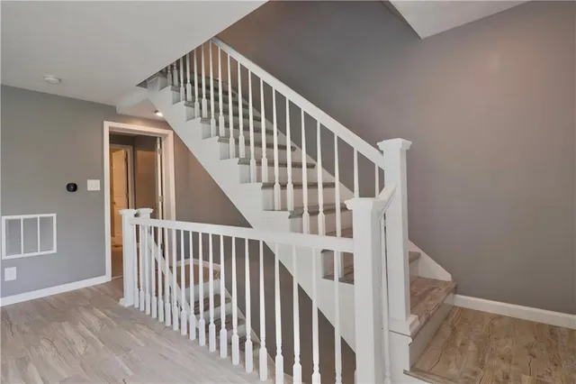 a view of an empty room and a window