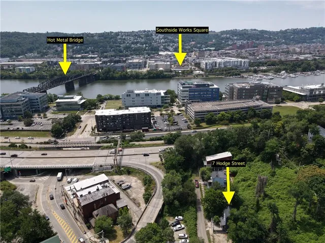 an aerial view of a house with swimming pool