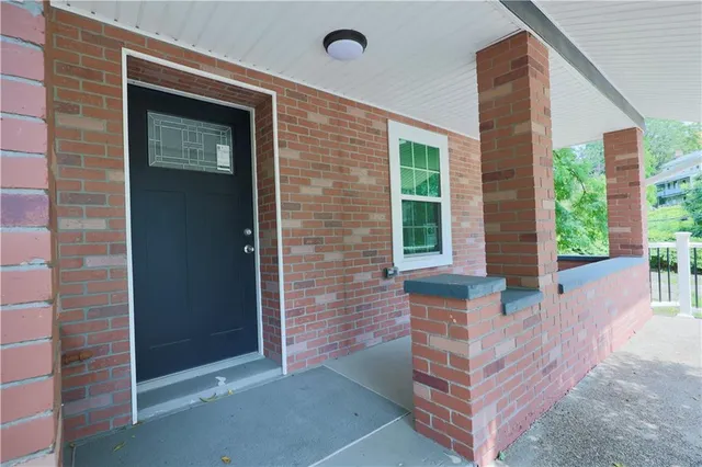 a backyard of a house with outdoor seating