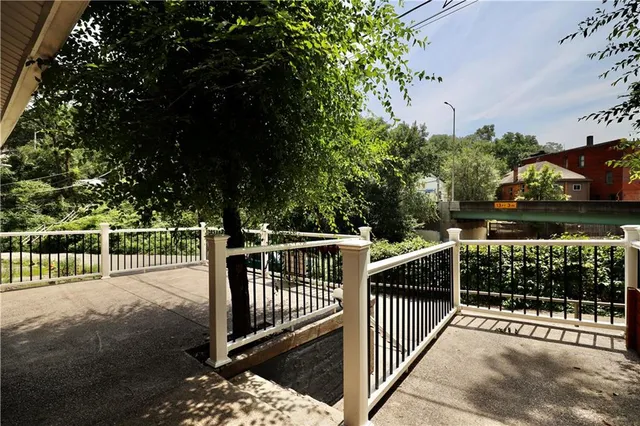 a kitchen with a refrigerator and a stove